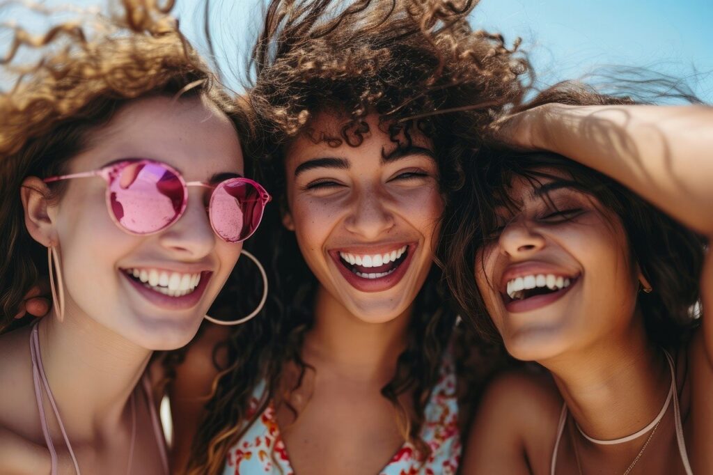 Close up of three women laughing